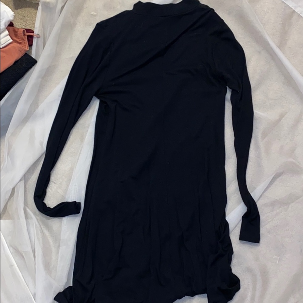 Black swing dress, mock neck, opened back